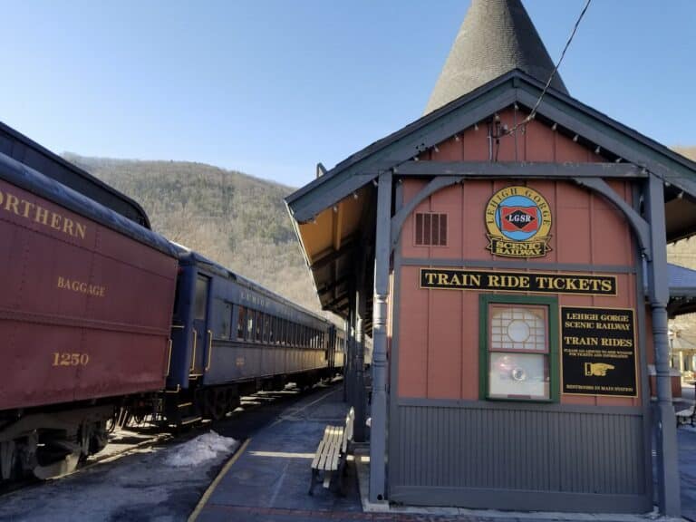 The Lehigh Gorge Scenic Railway train waiting beside the Victorian station ticket office in Jim Thorpe, Pennsylvania