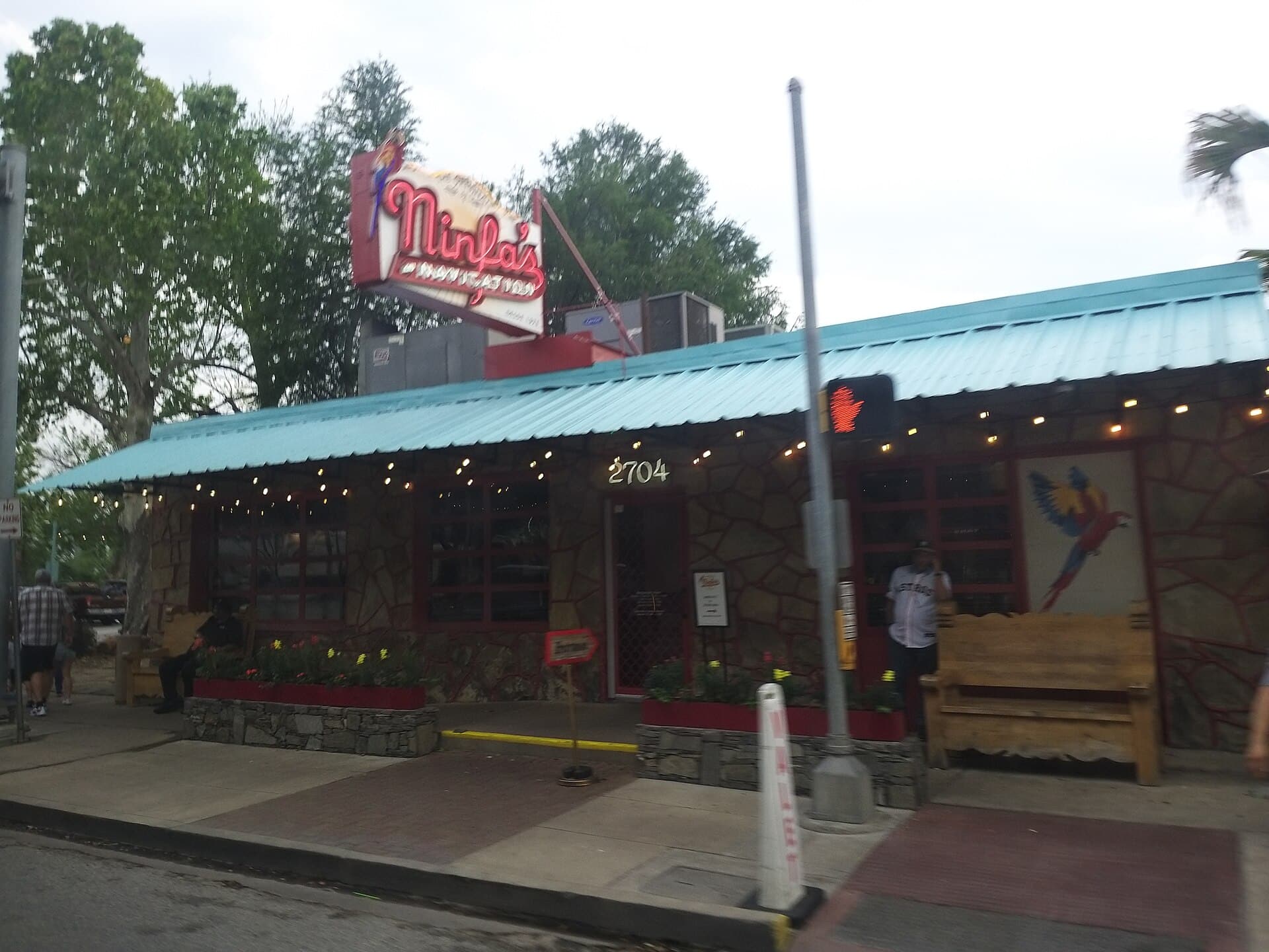 The front of The Original Ninfa's restaurant on Navigation Boulevard in Houston's East End, with its red sign and green awning