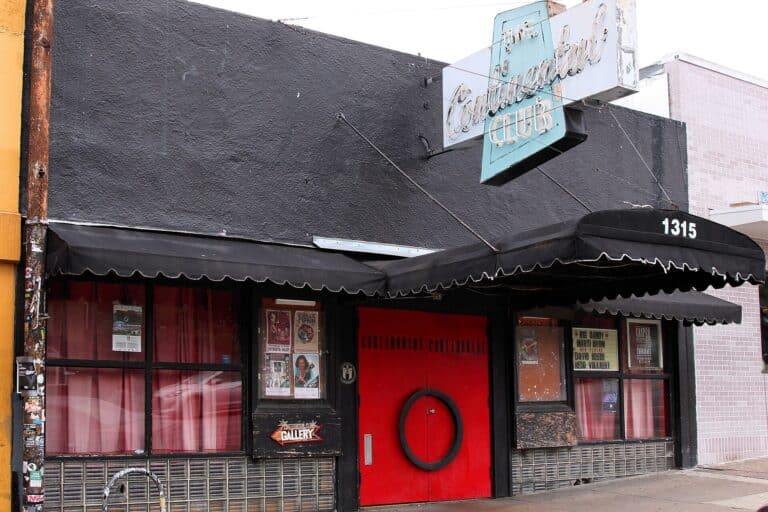 The red front door and black awning of The Continental Club live music venue on South Congress Avenue, Austin