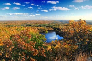Autumn foliage over a lake in the Pocono Mountains, Pennsylvania