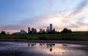 Downtown Houston skyline at sunset, seen across a park near the Texas Medical Center